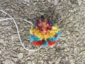One side of multicolored pompom