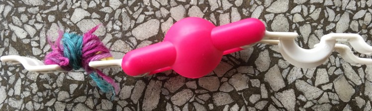 In-progress picture of multicolored pompom