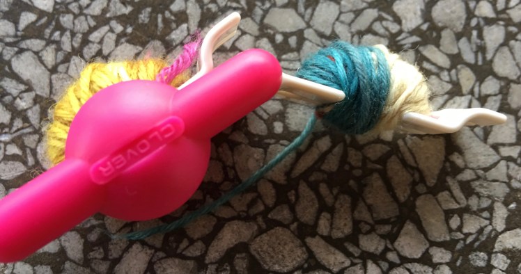 Two wrapped sides of uncut pompom