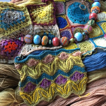 Beaded necklace complements colors of natural-dyed and acid-dyed yarn