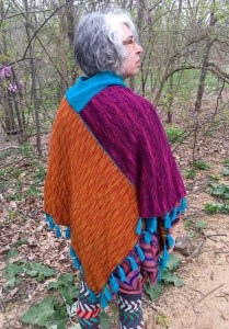Back view of one of four faces of reversible machine-knit poncho
