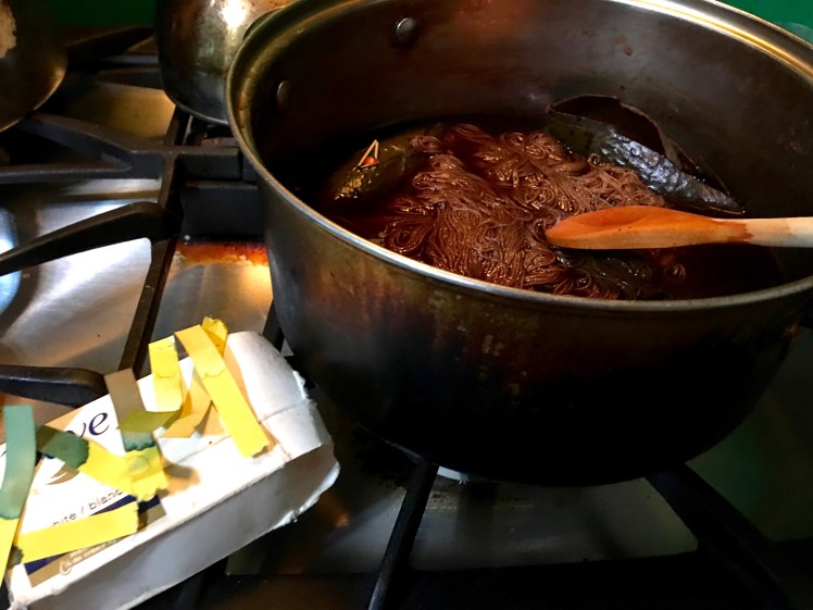 Extracting dye from avocado skins with alkaline modifier