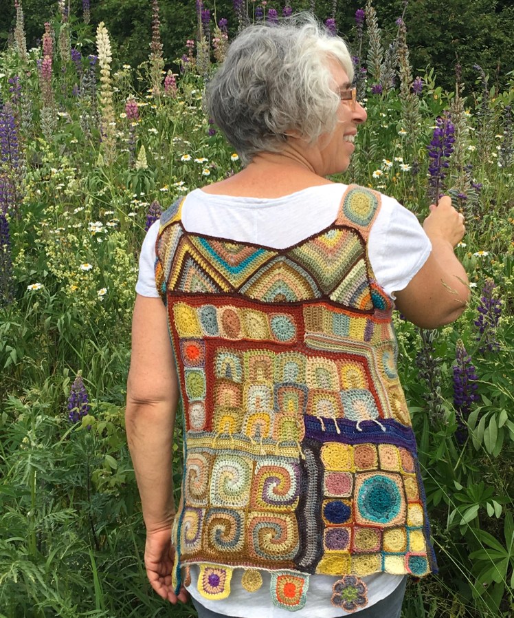 Patchwork top crocheted mostly in plant-dyed yarn