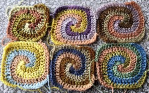 Spiral pinwheel motifs crocheted with plant-dyed yarn