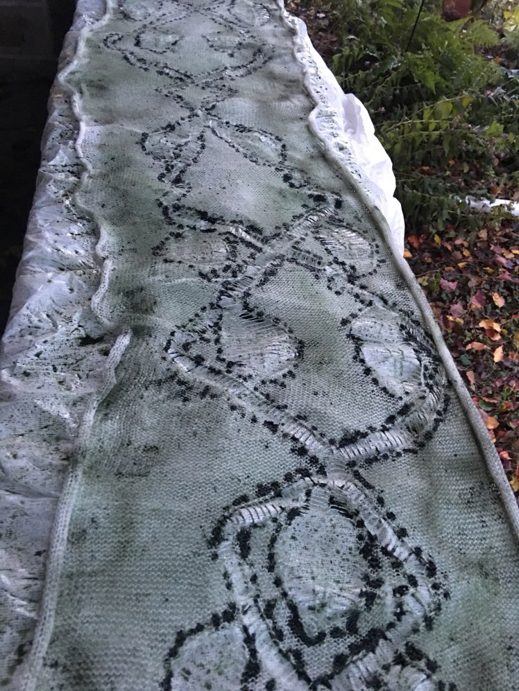 Dye sprayed and dotted onto machine-knit fabric