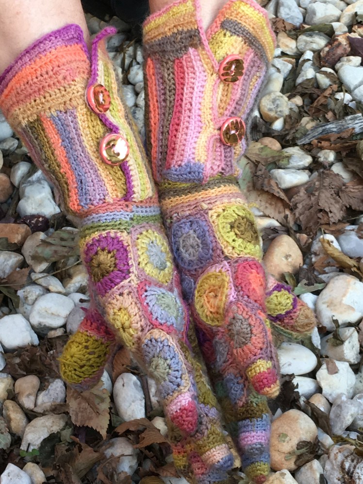 Sideways view of patchwork crochet gloves
