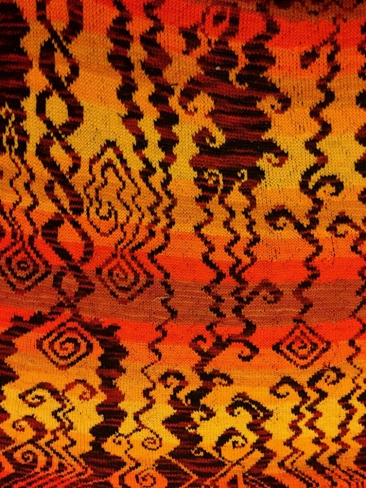 Improvised stranded knitting evoking a hellscape