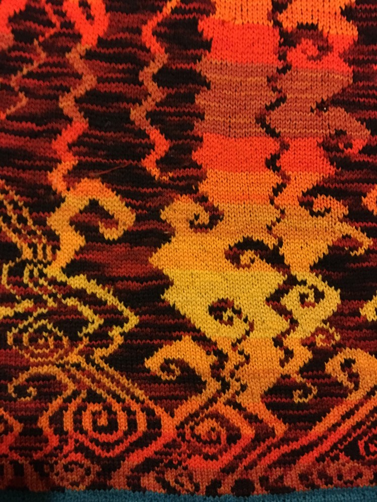 Improvised stranded knitting evoking a hellscape