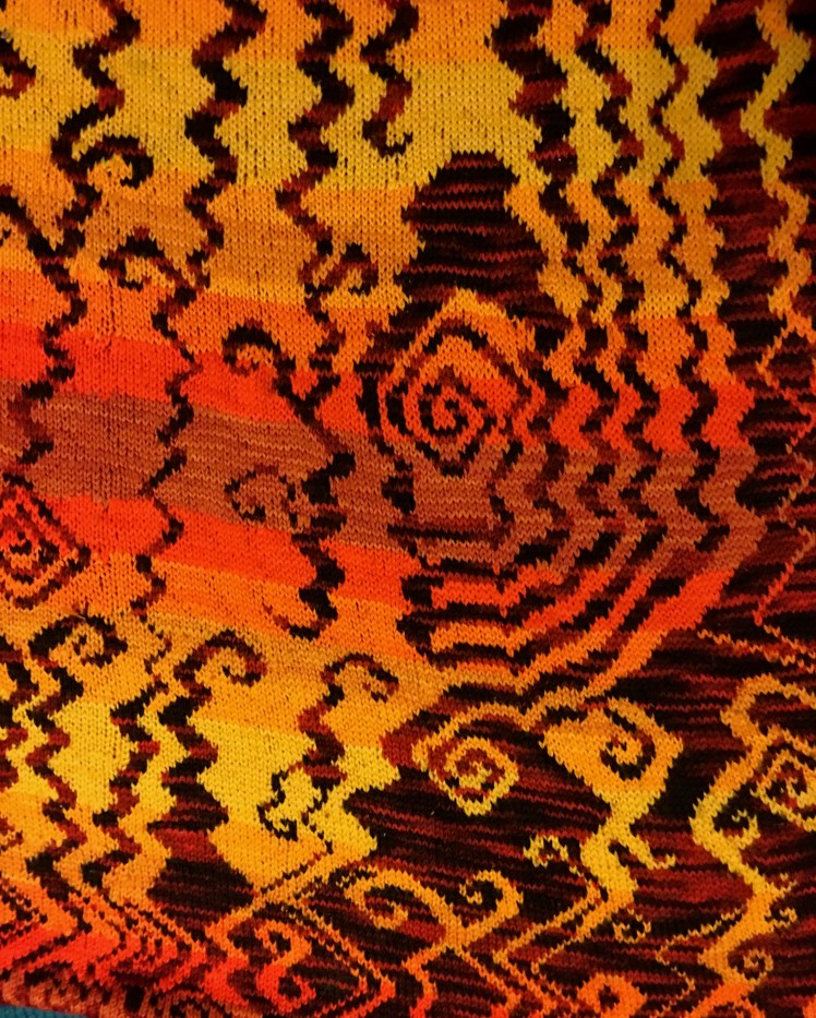 Improvised stranded knitting evoking a hellscape