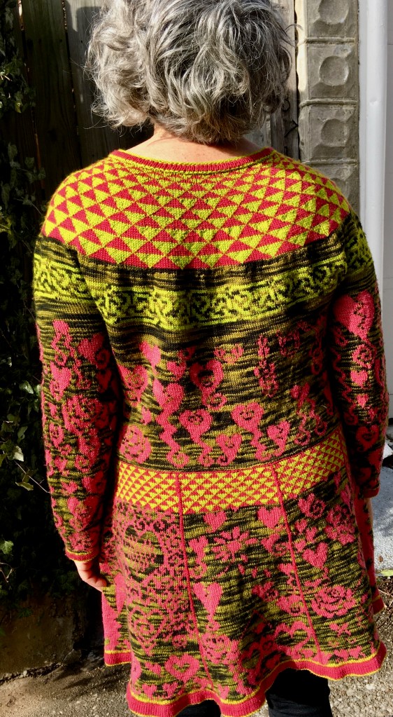 Rear view of knitted dress with symbolic social commentary