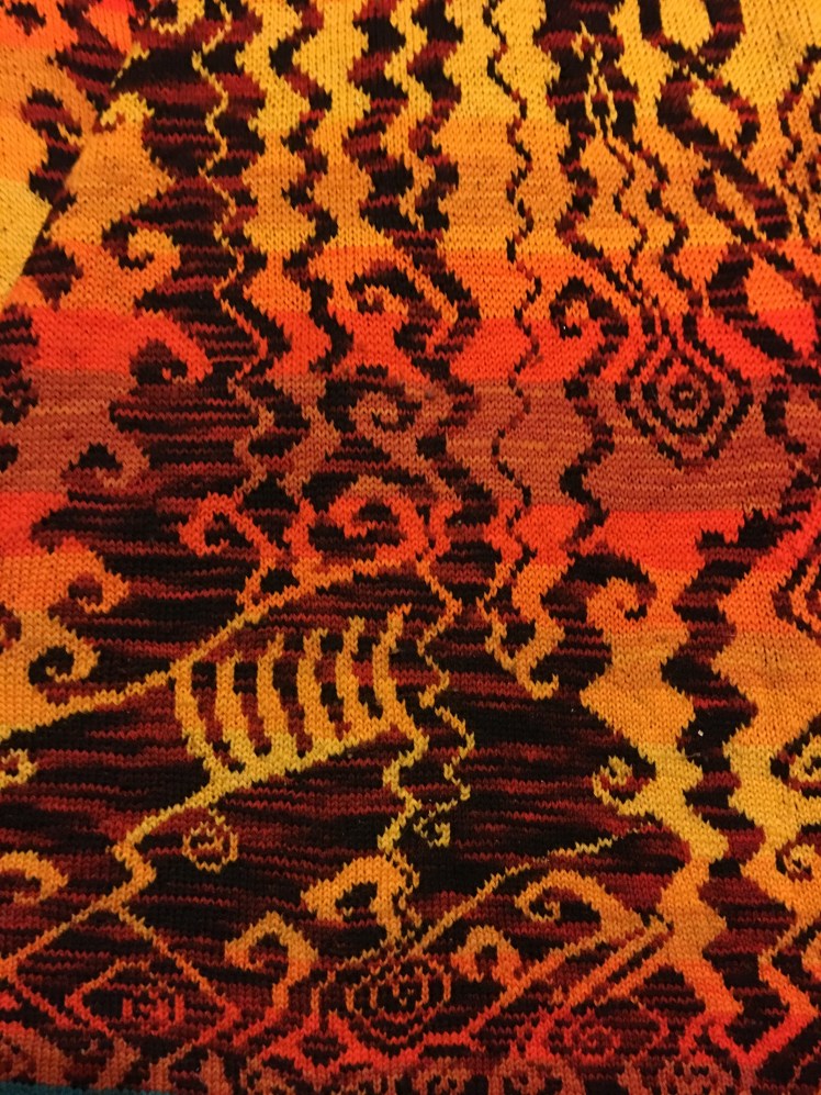 Improvised stranded knitting evoking a hellscape