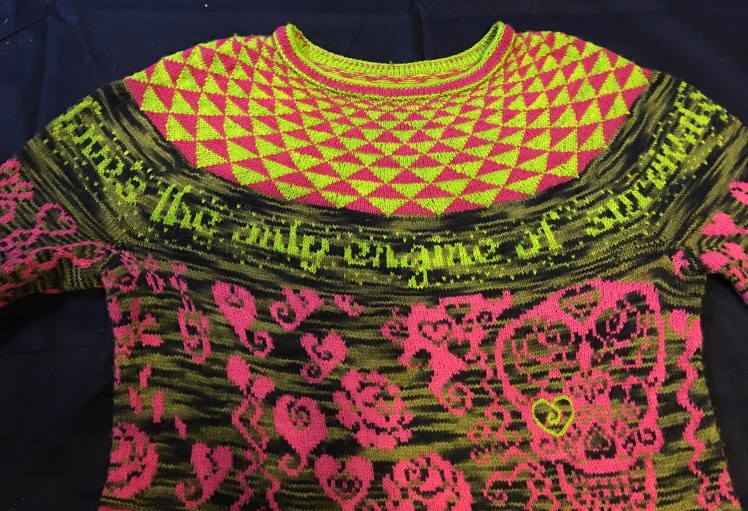 Text knitted into yoke of garment