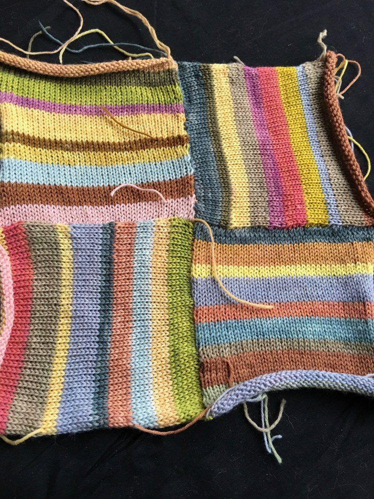 Swatch of machine-knit squares attached modularly in a patchwork