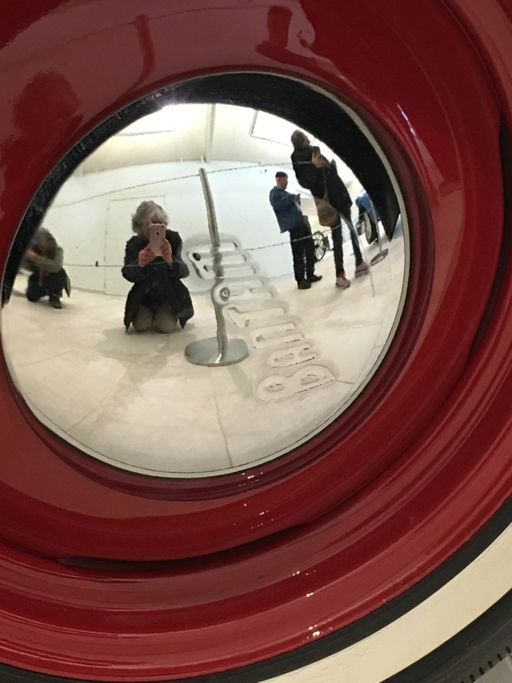 Reflections in hubcap of historical car at Frick Museum, Pittsburgh