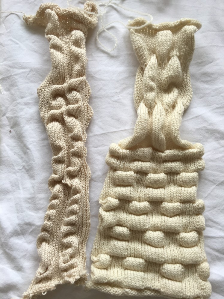 Machine knit swatches of pleated and tucked stitch patterns