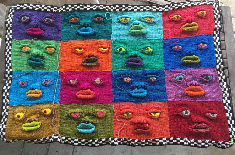 16 faces joined and bordered in checkerboard double-knitting