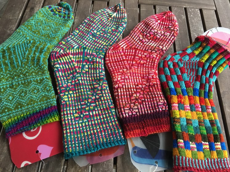 Four different socks made with Strong heel