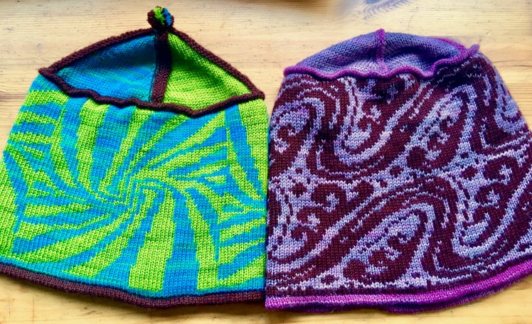Machine-knit hats knit in Stitch World preprogrammed fairisle patterns