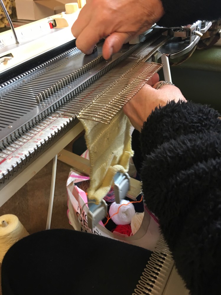 Knitting machine needles in hold position