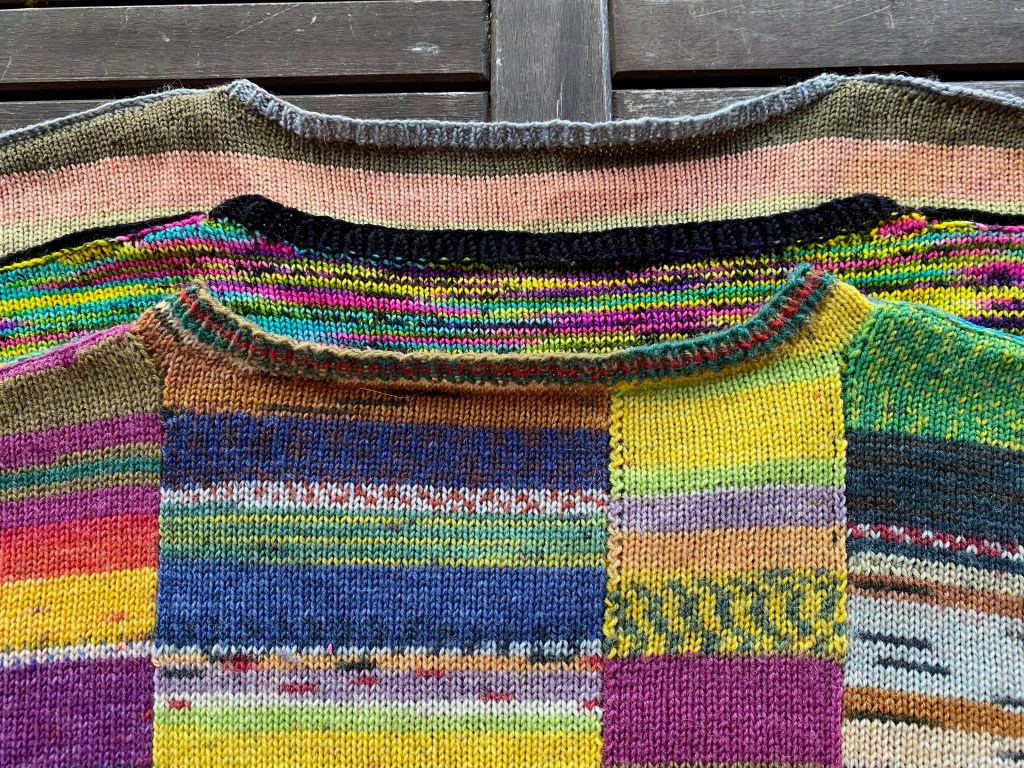 Back neck shaping of the three sweaters