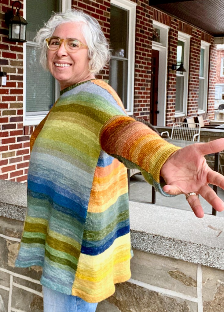 Side view of paneled pullover machine-knitted from plant-dyed yarn