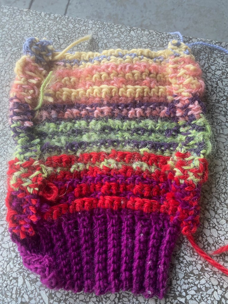 Edges of cut steek have been punched into the fabric of the swatch with a felting tool to prevent them from raveling