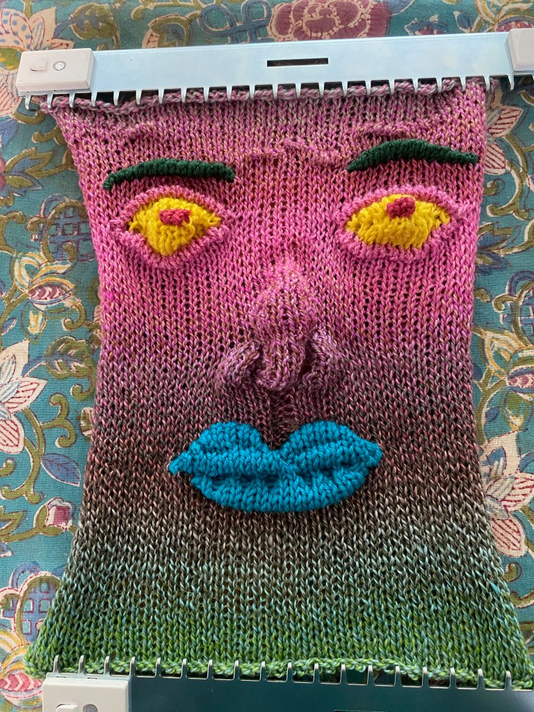 Machine-knit face before felting
